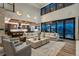 Expansive living room with soaring ceilings, modern decor, and an open floor plan flows seamlessly into a gourmet kitchen at 5140 S Kearney Ct, Greenwood Village, CO 80111