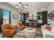 Stylish home office with custom built-ins, comfortable seating, and a modern chandelier for added sophistication at 5140 S Kearney Ct, Greenwood Village, CO 80111