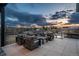 Outdoor patio features comfortable seating and panoramic views at sunset at 5140 S Kearney Ct, Greenwood Village, CO 80111