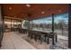 Covered patio is furnished with multiple dining tables and offers scenic views at 5140 S Kearney Ct, Greenwood Village, CO 80111