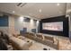 Home movie theater room with comfortable seating and a large screen at 5140 S Kearney Ct, Greenwood Village, CO 80111