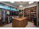Well-organized walk-in closet with custom shelving, ample storage, and a central island for accessories at 5140 S Kearney Ct, Greenwood Village, CO 80111