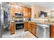 Kitchen with stainless steel appliances and wood cabinets at 833 E 98Th Ave # 204, Thornton, CO 80229