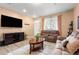 Living room with brown couches, a coffee table, and hardwood floors at 833 E 98Th Ave # 204, Thornton, CO 80229