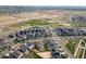 An aerial view showcasing the community layout, green spaces, and overall neighborhood at 21413 E 59Th Pl, Aurora, CO 80019