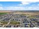 A bird's eye view showcasing a Primary-planned community with green spaces and residential areas at 21413 E 59Th Pl, Aurora, CO 80019