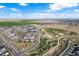 Aerial view of a neighborhood featuring green spaces, residential areas, and roadways at 21413 E 59Th Pl, Aurora, CO 80019