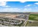 Wide aerial view of the residential area, nearby roads, and expansive open land at 21413 E 59Th Pl, Aurora, CO 80019