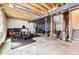 Unfinished basement featuring high ceilings, exposed beams, and ample space for customization or storage at 21413 E 59Th Pl, Aurora, CO 80019
