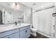 Bathroom with single sink, quartz counters, toilet, and shower with a curtain for a clean and functional space at 21413 E 59Th Pl, Aurora, CO 80019