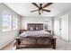 Spacious bedroom featuring rustic wood furnishings and a contemporary ceiling fan fixture at 21413 E 59Th Pl, Aurora, CO 80019