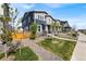 Well-maintained home featuring professionally landscaped front yard, pathway, and neighboring homes at 21413 E 59Th Pl, Aurora, CO 80019