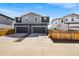 Charming two-story home featuring a two-car garage and neutral-toned exterior at 21413 E 59Th Pl, Aurora, CO 80019