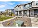 Inviting home with covered porch, neutral siding, stone accents, and nicely landscaped front yard at 21413 E 59Th Pl, Aurora, CO 80019