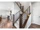 Modern staircase with carpeted steps and metal railings leading to the upper level at 21413 E 59Th Pl, Aurora, CO 80019