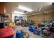 Large garage space showcasing off-road vehicles, storage solutions, and room for projects at 11413 Oswego St, Commerce City, CO 80640