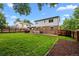 Spacious backyard with well-maintained lawn, patio, perfect for entertaining and outdoor relaxation at 4550 E 121St Pl, Thornton, CO 80241