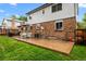 The backyard boasts a large patio, grill, and dining furniture for outdoor enjoyment at 4550 E 121St Pl, Thornton, CO 80241