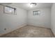 Unfinished basement with carpeted floors and natural light, offering potential for customization at 4550 E 121St Pl, Thornton, CO 80241