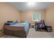 Cozy bedroom featuring a comfortable bed, natural light, and a relaxed ambiance at 4550 E 121St Pl, Thornton, CO 80241