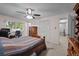 Spacious bedroom featuring a large window, ample closet space, and a cozy atmosphere at 4550 E 121St Pl, Thornton, CO 80241