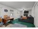 The living room features green carpet, a fireplace, and exterior access to the yard at 4550 E 121St Pl, Thornton, CO 80241