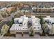 Aerial view of modern townhomes with rooftop decks and attached garages at 8071 E 29Th Ave, Denver, CO 80238
