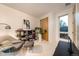 Bright bedroom with a modern chair, stylish bookcase, and large window, creating a cozy retreat at 8071 E 29Th Ave, Denver, CO 80238