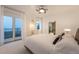 Bright bedroom with terrace access, comfortable king bed, and an en-suite entrance to the closet at 8071 E 29Th Ave, Denver, CO 80238