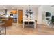 Dining area featuring a modern light fixture and an abstract art piece at 8071 E 29Th Ave, Denver, CO 80238