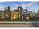 Modern home with lovely landscape, large windows, and manicured bushes at 8071 E 29Th Ave, Denver, CO 80238