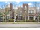 Modern townhome with a well-manicured lawn and contemporary architectural details at 8071 E 29Th Ave, Denver, CO 80238
