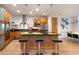 Bright kitchen featuring stainless appliances, a large island, and modern lighting at 8071 E 29Th Ave, Denver, CO 80238