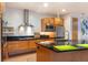 Spacious kitchen featuring stainless appliances, bar seating, and modern cabinetry at 8071 E 29Th Ave, Denver, CO 80238