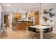 Kitchen and dining area with an island, stainless steel appliances, and hardwood floors at 8071 E 29Th Ave, Denver, CO 80238