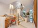 Landing area with a built-in desk, carpeted staircase and modern railing system at 8071 E 29Th Ave, Denver, CO 80238