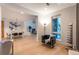 Modern open-concept floor plan with a living area, dining room, and stylish furnishings at 8071 E 29Th Ave, Denver, CO 80238