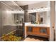 Modern main bathroom features a glass shower, dual sinks, vanity and large mirrors at 8071 E 29Th Ave, Denver, CO 80238
