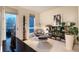 Modern office area boasts sleek furniture, built-in shelving, and natural light, perfect for remote work at 8071 E 29Th Ave, Denver, CO 80238