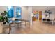 Bright office space with large windows, stainless steel desk and access to dining area at 8071 E 29Th Ave, Denver, CO 80238
