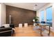 Office area with exposed brick wall, modern decor and large windows at 8071 E 29Th Ave, Denver, CO 80238