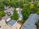 Aerial view of a neighborhood with lush greenery and diverse architectural styles at 2485 S Fillmore St, Denver, CO 80210