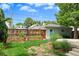 Backyard featuring a garden, a basketball hoop, and a storage shed with a green door at 2485 S Fillmore St, Denver, CO 80210