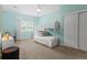 Light-filled bedroom with bunkbeds, a window, and a closet with sliding doors at 2485 S Fillmore St, Denver, CO 80210