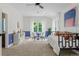 Bonus room with stylish décor, a cozy day bed, and lots of seating at 2485 S Fillmore St, Denver, CO 80210