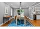 Dining room with modern lighting, a large table, and a view of the backyard at 2485 S Fillmore St, Denver, CO 80210