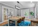 Well-lit dining room featuring stylish furniture and access to other living areas at 2485 S Fillmore St, Denver, CO 80210