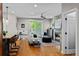 Open living area with hardwood floors, stone fireplace and plenty of natural light at 2485 S Fillmore St, Denver, CO 80210