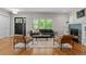 Spacious living room features a fireplace, large windows, and comfortable seating at 2485 S Fillmore St, Denver, CO 80210