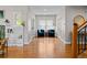 Elegant living room featuring wood floors and large windows that bring in natural light at 2485 S Fillmore St, Denver, CO 80210